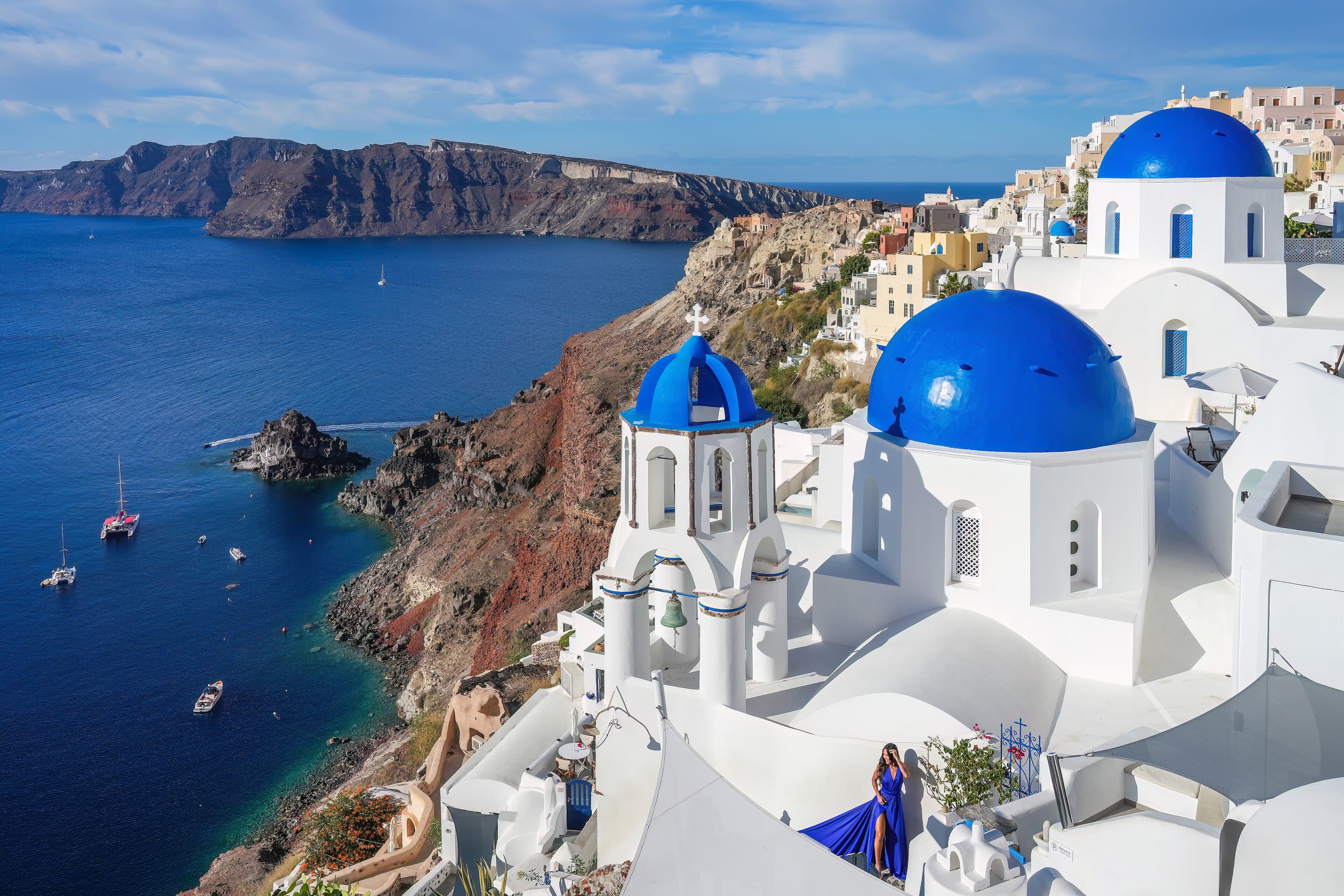 Blue-domed churches above the caldera in Oia, Santorini.